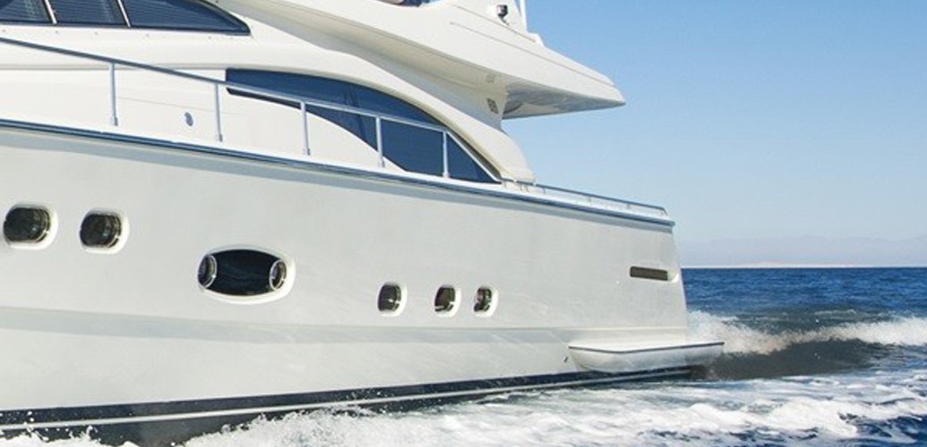 black exhaust fumes behind a superyacht - featured image